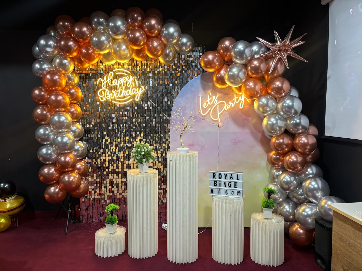 Orange and silver balloon arch